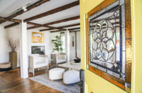 Indoor lounge with chairs and wall art