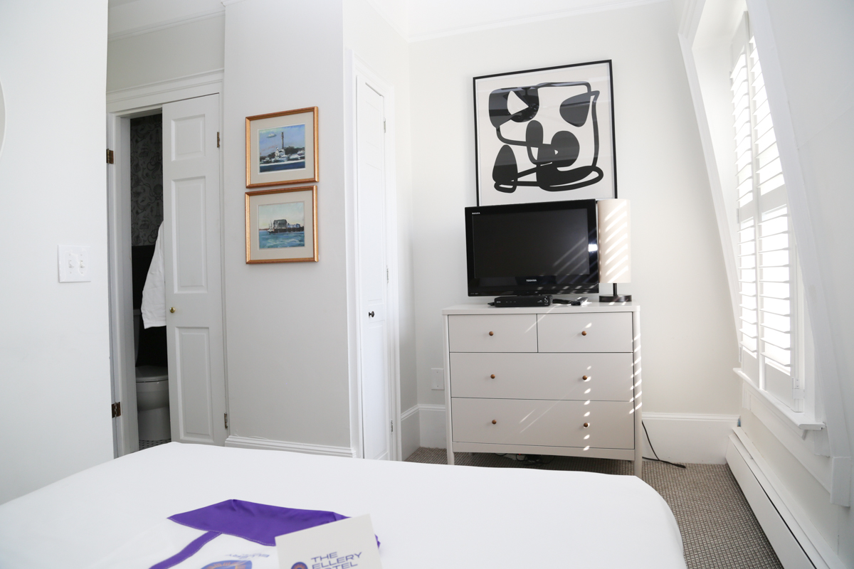Bedroom with dresser and TV