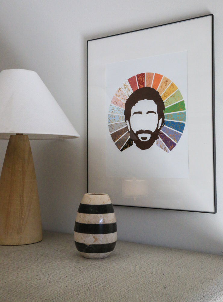 Lamp and framed art on a table