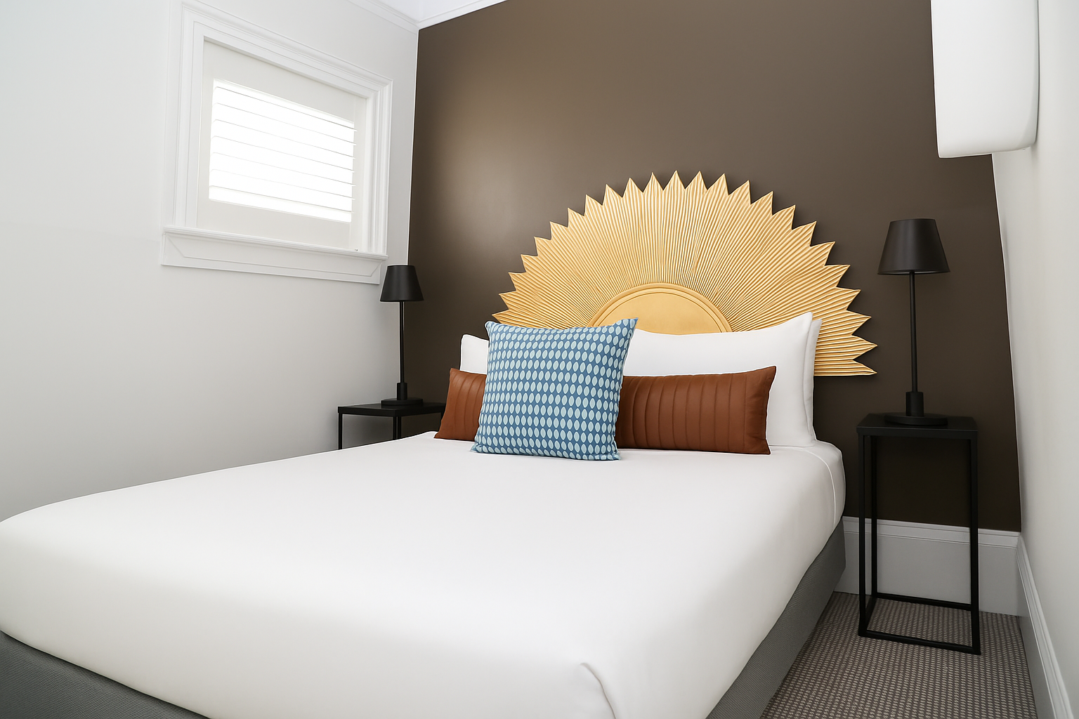 Large bed with round sunburst headboard