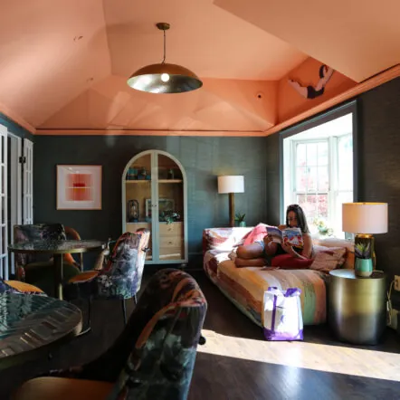 Colorful lounge with armchairs and large windows