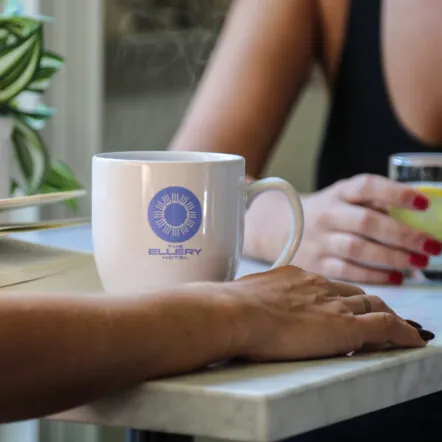 Two people having drinks at a small table