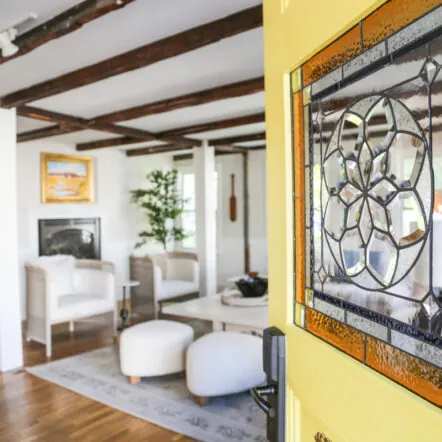 Indoor lounge with chairs and wall art