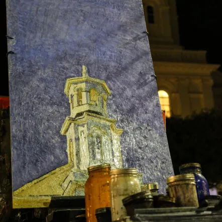 A building projectd onto a screen at night