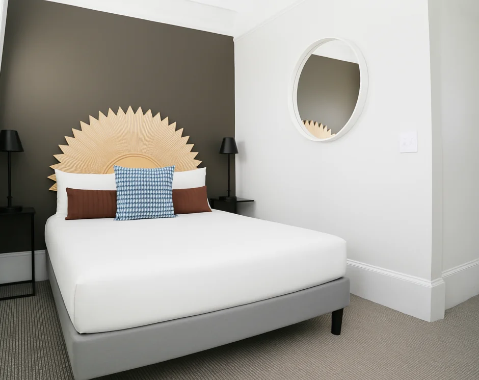 Large bed with round sunburst headboard